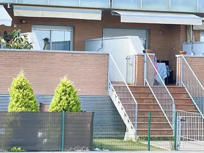 a set of stairs in front of a house at Onze - primera línea de mar con piscina in Cubelles