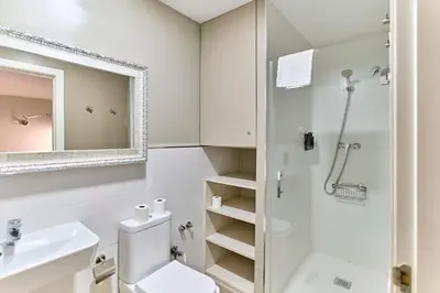 a bathroom with a toilet and a sink and a shower at Montserrat Apartments by gaiarooms in Barcelona