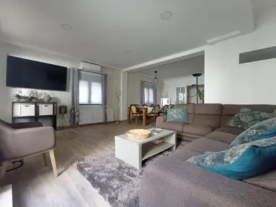a living room with a couch and a table at Edard's Great House in Castelldefels