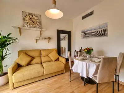 a living room with a couch and a table at Apartment PICNIC SANTS in Barcelona