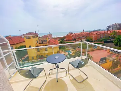 a balcony with a table and two chairs on a balcony at HUG HOTEL2022 in El Carrer del Canonge