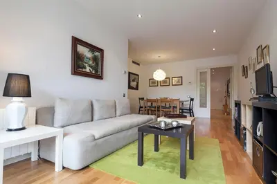 a living room with a couch and a table at Key Gracia Apartments in Barcelona