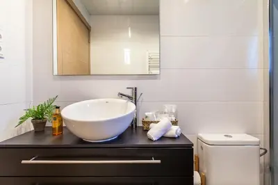 a bathroom with a large bowl sink on a counter at Casa 20 minutos de Barcelona y WIFI alta capacidad in Sant Cugat del Vallès