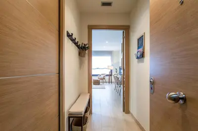 a hallway with a door leading to a living room at Casa 20 minutos de Barcelona y WIFI alta capacidad in Sant Cugat del Vallès