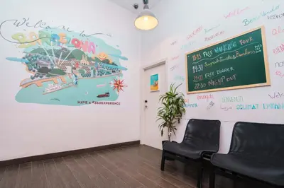 a waiting room with a large painting on the wall at 360 Hostel Borne in Barcelona