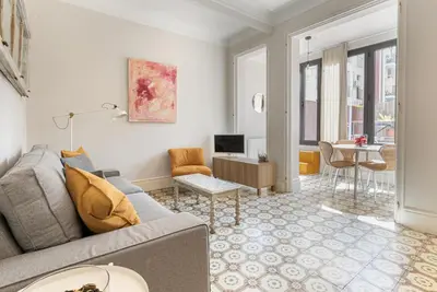 a living room with a couch and a table at Weflating Sant Antoni Market in Barcelona
