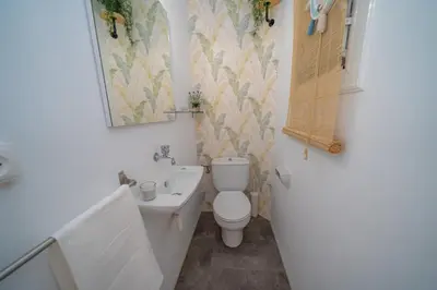 a small bathroom with a toilet and a sink at HomeHolidaysRentals Eiffel - Costa Barcelona in Pineda de Mar