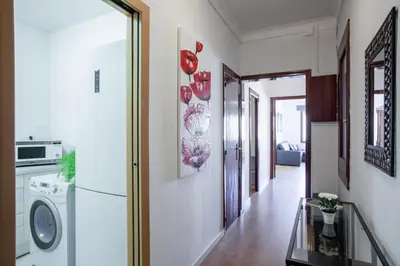 a hallway with a washer and dryer in a house at Sagrada Familia LEPANT in Barcelona