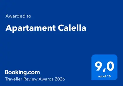 a blue sign that says appointment calidad with the words travel review awards at Apartament Calella in Calella