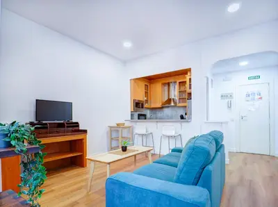 a bathroom with a toilet and a glass shower at La Cubana Apartment by Hello Homes Sitges in Sitges