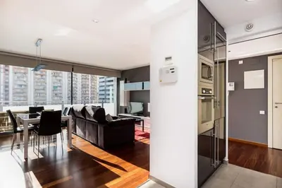 a living room with a couch and a table at Modern Luxury Apartment Fira Bcn in Hospitalet de Llobregat
