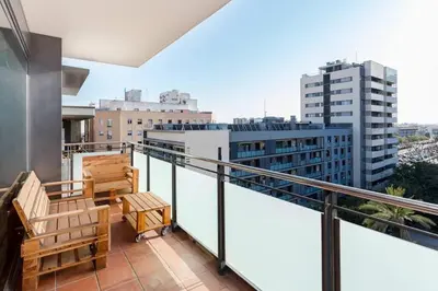 a balcony with a view of a city at Modern Luxury Apartment Fira Bcn in Hospitalet de Llobregat