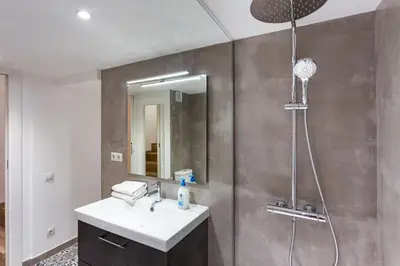 a bathroom with a sink and a shower at Stay U-nique Apartments Travessera II in Barcelona