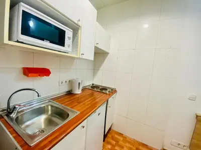 a kitchen with a sink and a microwave at 01 Apartamento 2 ,3 in Barcelona