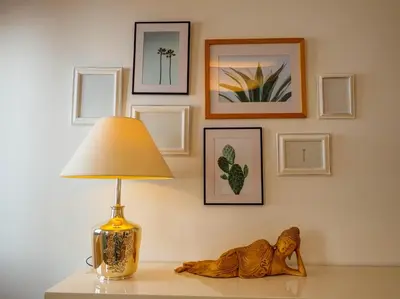 a lamp sitting on top of a table with a iguana on it at Elite Bonaire Penthouse by Hello Homes Sitges in Sitges