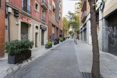 an empty street in a city with buildings at Sagrada Familia- Excelente Ubicación in Barcelona