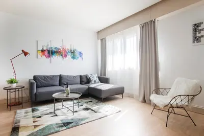 a living room with a couch and a table at Tendency Apartments 5 in Barcelona