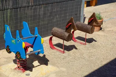 a childrens playground with a toy swing at Casa Martina in Cardedeu