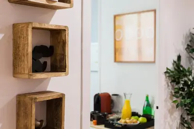 a kitchen with two wooden boxes on the wall at Be Barcelona Plaza Catalunya in Barcelona