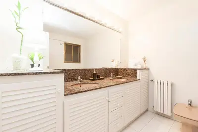 a bathroom with a sink and a large mirror at Be Barcelona Plaza Catalunya in Barcelona