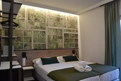 a bedroom with a bed with towels on it at Casp Green House in Barcelona