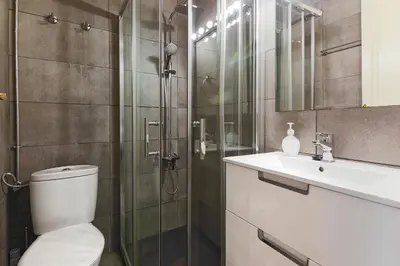 a bathroom with a toilet and a sink and a shower at Be Barcelona Eixample Universidad in Barcelona