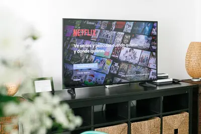 a flat screen tv sitting on top of a table at Be Barcelona Eixample Universidad in Barcelona