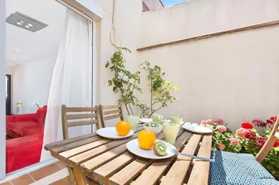 a wooden table with oranges on it in a living room at Atic Barcelona in Barcelona