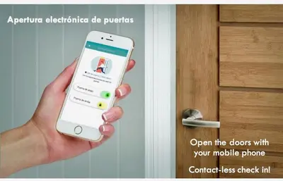 a person holding a iphone in front of a door at Atic Barcelona in Barcelona