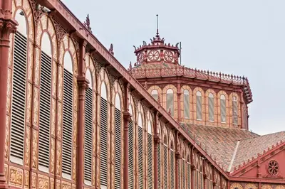 a building with a clock tower on top of it at Sweett - La Villarroel in Barcelona