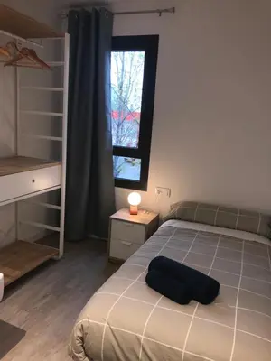 a bedroom with a bed and a window at Llull Home in Sant Adria de Besos
