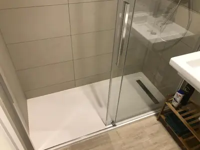 a shower with a glass door in a bathroom at Llull Home in Sant Adria de Besos