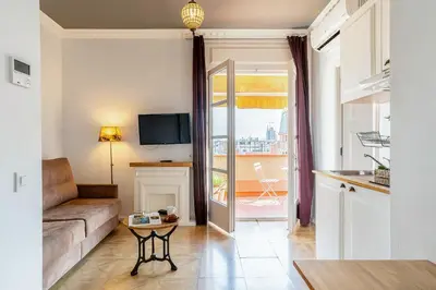 a living room with a couch and a table at Casa Gracia Apartments in Barcelona