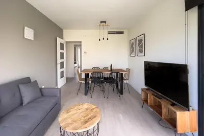 a living room with a couch and a table at chicStays Apartment Ciutadella Park in Barcelona