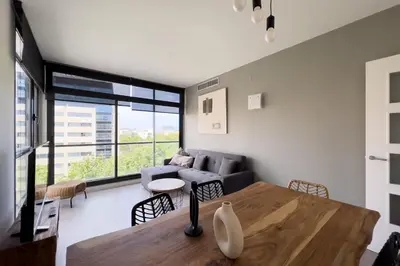 a living room with a table and a couch at chicStays Apartment Ciutadella Park in Barcelona