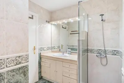 a bathroom with a sink and a shower at Plaza Espanya Apartment in Barcelona