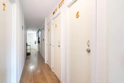 a bedroom with a bed and a bathroom with a mirror at Hostal Sant Antoni in Barcelona