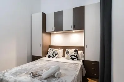 a bedroom with a bed with two towels on it at Hostal Sant Antoni in Barcelona
