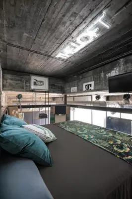 a bedroom with a large bed with pillows on it at THE LOFT - with private pool & jacuzzi in Corbera de Llobregat