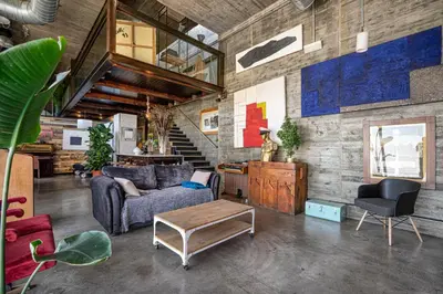 a living room with a couch and a table at THE LOFT - with private pool & jacuzzi in Corbera de Llobregat