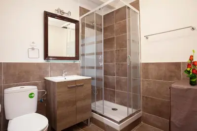 a bathroom with a shower and a toilet and a sink at Esquirol in Barcelona