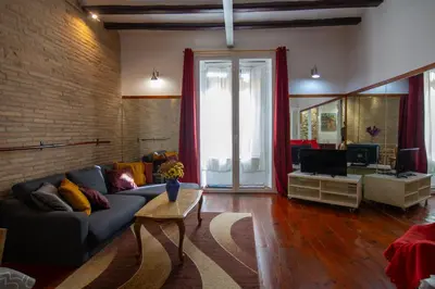 a living room with a couch and a table at Gaudí Ramblas in Barcelona