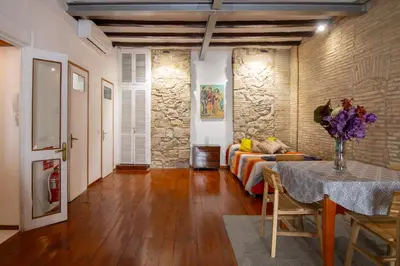 a living room with a couch and a table at Gaudí Ramblas in Barcelona