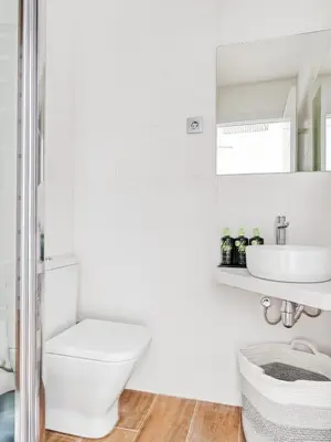 two beds in a room with a window at Limehome Barcelona Carrer de Fontcoberta - Digital Access in Barcelona