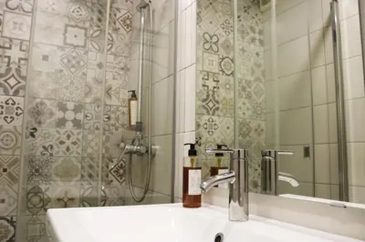a bathroom with a sink and a shower at MonResidence Bellavista in Manresa