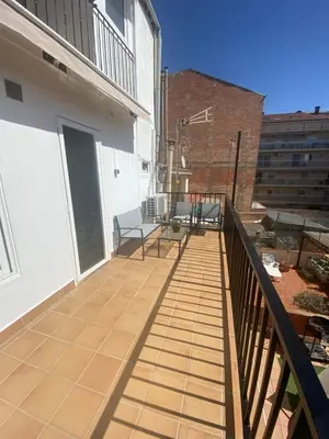 a balcony of a building with chairs on it at MonResidence Bellavista in Manresa