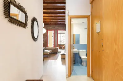 a hallway with a toilet and a living room at Moianes Apartment by Olala Homes in Barcelona