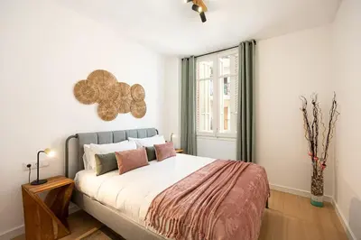 a bedroom with a large bed and a window at Charming 2br In Trendy Gracia in Barcelona
