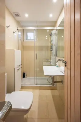 a bathroom with a toilet and a sink and a shower at Charming 2br In Trendy Gracia in Barcelona