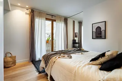 a living room with a dining table and a living room at BENI - 1 bedroom apartment with pool and terrace in Gracia in Barcelona